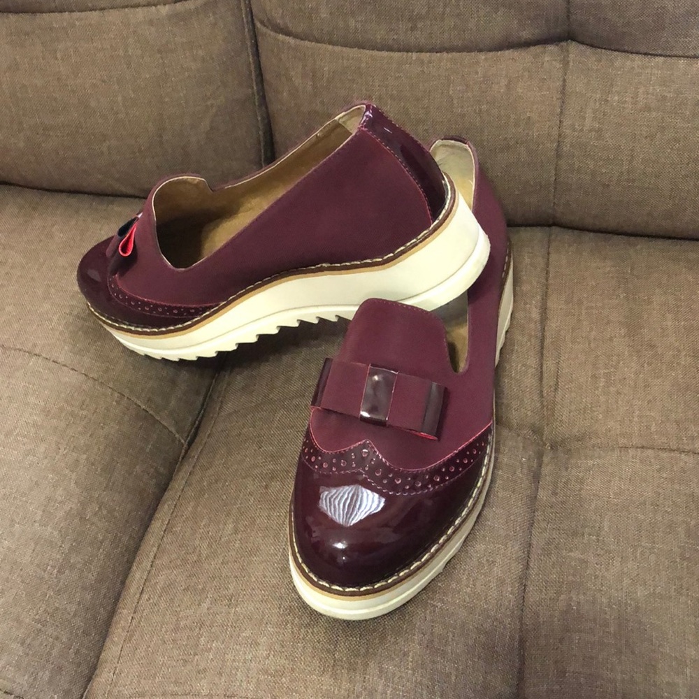 Women’s burgundy moccasins in size 8